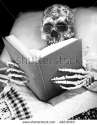stock-photo-skeleton-reads-in-bed-49218319.jpg
