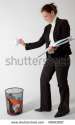 stock-photo-business-woman-throwing-papers-into-a-trash-bin-40663087.jpg