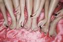 18897581-Teenage-girls-painting-toenails-on-pink-sheets-high-angle-view-close-up-Stock-Photo.jpg