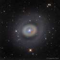 A ring of newly formed stars at its nucleus gives Starburst Galaxy M94 its colorful appearance.jpg