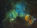 The Jellyfish Nebula. The large orange mass near the bottom right is supernova IC 443, and the two bright stars at the bottom are Mu and Eta Geminorum.jpg