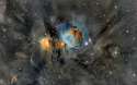 The Orion Nebula, surrounded by dust.jpg