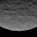 The cause of the large mountain on asteroid Ceres, as well as its bright spots, are still a mystery.jpg