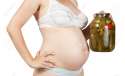 9853524-Closeup-of-pregnant-woman-holding-glass-jar-with-pickled-cucumbers-on-white-background-Stock-Photo.jpg