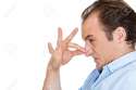 Closeup_side_view_portrait_of_young_man_disgust_on_his_face_pinches_his_nose_something_stinks_very_bad.jpg
