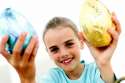 Girl-holding-up-foil-wrapped-chocolate-Easter-eggs.jpg