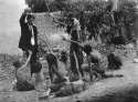 Turkish officials teasing Armenian children during the genocide, 1915.jpg