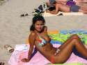 Young_woman_at_the_beach_in_the_sun[1].jpg