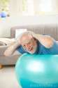 happy-active-senior-exercises-fit-ball-16618186.jpg
