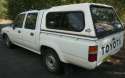 1994-1997_Toyota_Hilux_(RN85R)_DX_4-door_utility_04.jpg