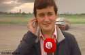 reporter hit by racecar.gif