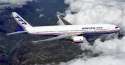 Boeing_777_above_clouds.jpg