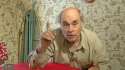 Jim Lahey @ red table index finger up with glass.jpg