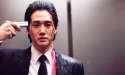 an asian man with a handgun to his head.jpg