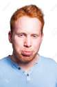 21361444-Young-redhead-boy-making-a-sad-expression-isolated-on-white--Stock-Photo.jpg