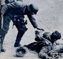 german_soldier_helping_wounded_american.jpg