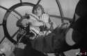 Erwin Seeger, a fallschirmjäger kriegsberichter (XI.Flieger-Korps), posing on the bomber seat of an Heinkel He-111. The plane is flying a transfer flight from Sicily to Tunisia, carrying Gotha Go-242 gliders. 1942.jpg