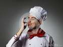 male-chef-kissing-fingers-against-grey-background-34468914.jpg