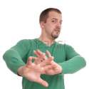 27475764-young-man-gesturing-with-raised-hands.jpg