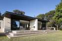black-flat-roof-material-wood-ceiling-material-single-story-modern-minimalist-house-with-open-window-sliding-door-simple-green-landscaping-design-roof-house-design-exterior-architecture-inspiring-sty.jpg
