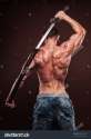 stock-photo-shirtless-young-man-posing-with-katana-sword-130162259.jpg