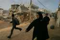 Armored Bulldozer Destroys Palestinian Home.jpg