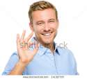 stock-photo-happy-man-giving-okay-sign-portrait-on-white-background-141327337.jpg