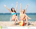 girls-sunbathing-beach-chairs-summer-holidays-vacation-33337999[1].jpg