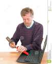 broken-computer-repair-man-laptop-frustrated-user-attacking-hammer-31228655.jpg