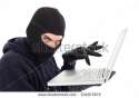 stock-photo-hacker-in-balaclava-standing-and-typing-on-laptop-on-white-background-232073572.jpg