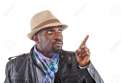 12922106-Young-stylish-black-man-pointing-with-his-finger--Stock-Photo.jpg