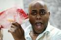 Ainsley-Harriott-Legend-With-A-Fish.jpg