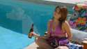 Sarah Haley poolside with a beer.jpg