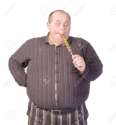 15869794-Fat-obese-man-enjoying-a-a-long-colourful-striped-lollipop-standing-licking-it-with-a-look-of-comple-Stock-Photo.jpg
