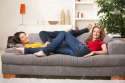 6374077-Happy-teen-girls-lying-on-sofa-together-smiling-at-camera-having-rest-at-home--Stock-Photo.jpg