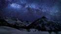 Starry_sky_and_snowy_mountains.jpg