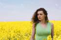 4889035-Portrait-of-a-sad-woman-in-rape-flower-field-Stock-Photo.jpg