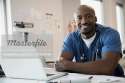 6117-07999494em-Portrait-of-smiling-doctor-in-scrubs-in-clinic.jpg