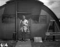 Harold Agnew carrying the plutonium core of the Nagasaki Fat Man bomb, 1945.jpg