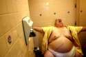 fat guy taking a dump.jpg