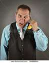 stock-photo-an-angry-business-man-is-talking-on-a-banana-phone-on-an-isolated-gray-background-for-a-humorous-399868993.jpg