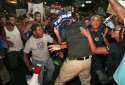 trump-sign-holder-attacked-mob.jpg