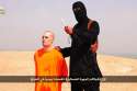 A-masked-Islamic-State-militant-holding-a-knife-speaks-next-to-man-purported-to-be-US-journalist-James-Foley.jpg