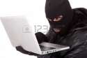 13067542-disguised-computer-hacker.jpg