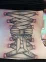 Coolest-Grey-Ink-3d-Piercing-Corset-Tattoo-On-Lower-Back.jpg