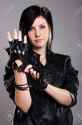 11209705-Young-punk-girl-in-leather-over-gray-background-Stock-Photo.jpg