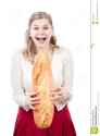 woman-laughing-holding-loaf-bread-23822133.jpg