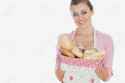 18100883-Portrait-of-beautiful-woman-holding-bread-basket-over-white-background-Stock-Photo.jpg