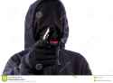 burglar-face-unknown-person-sports-jacket-aiming-gun-direction-viewer-concept-attack-crime-65107630.jpg