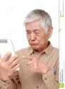 senior-japanese-man-using-tablet-computer-looking-confused-portrait-white-background-50634270[1].jpg